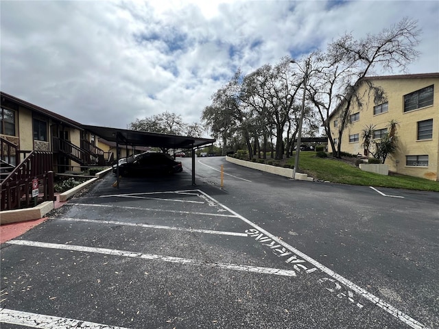 view of partially covered parking lot