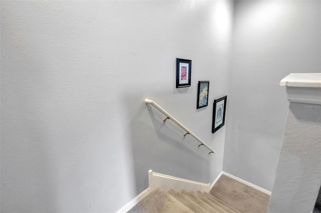 stairway with carpet and baseboards