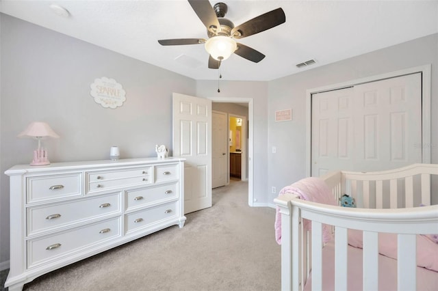 bedroom with light carpet, baseboards, visible vents, ceiling fan, and a closet