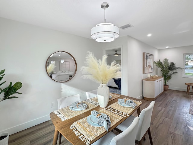 dining space with recessed lighting, baseboards, and wood finished floors