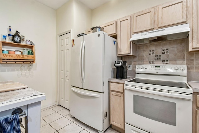 kitchen featuring white appliances, light countertops, under cabinet range hood, and light brown cabinets