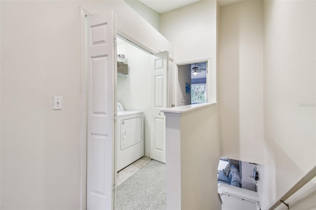 laundry room featuring washer / clothes dryer, light tile patterned floors, and laundry area