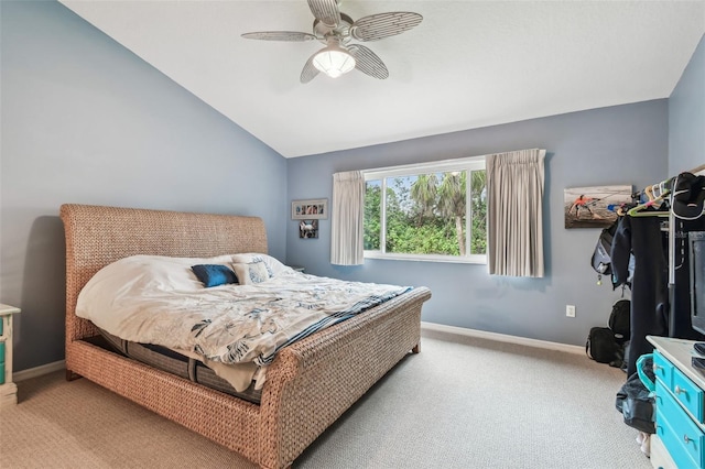 bedroom with lofted ceiling, baseboards, carpet floors, and a ceiling fan