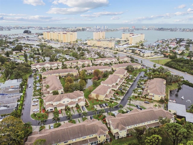 birds eye view of property with a water view, a view of city, and a residential view