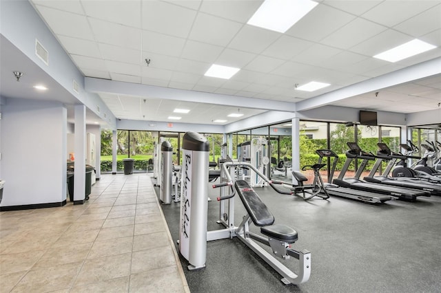 workout area featuring visible vents and a drop ceiling