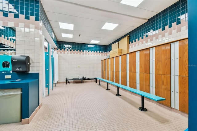 interior space with a paneled ceiling