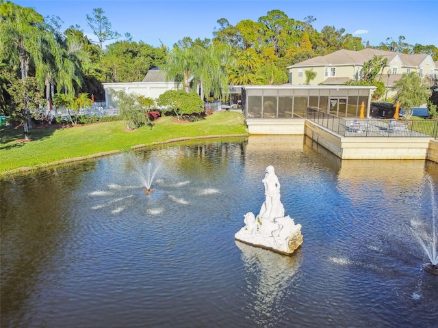 property view of water featuring fence