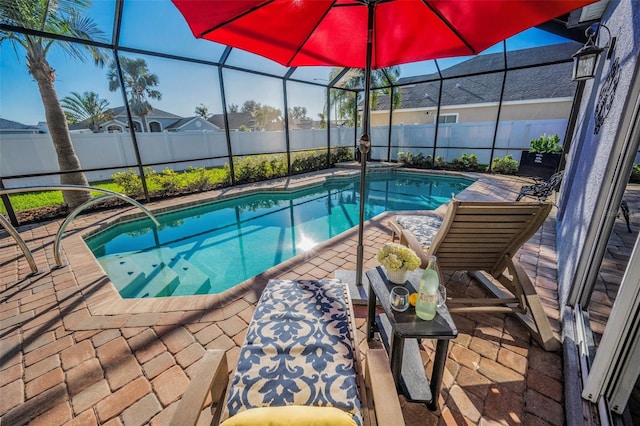 view of swimming pool with a fenced in pool, a patio area, a lanai, and a fenced backyard