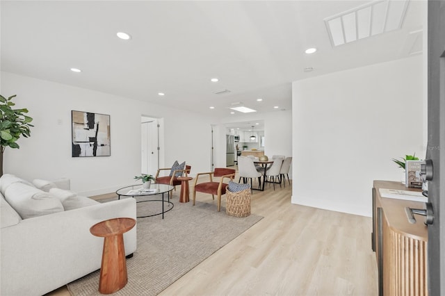 living room featuring recessed lighting and light wood-style floors