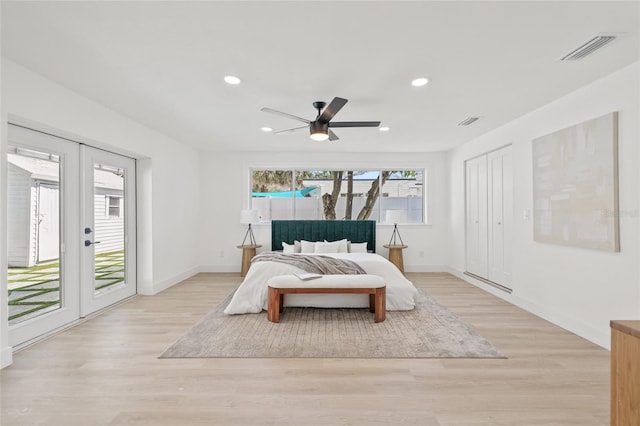 bedroom featuring access to outside, french doors, visible vents, and light wood-style floors