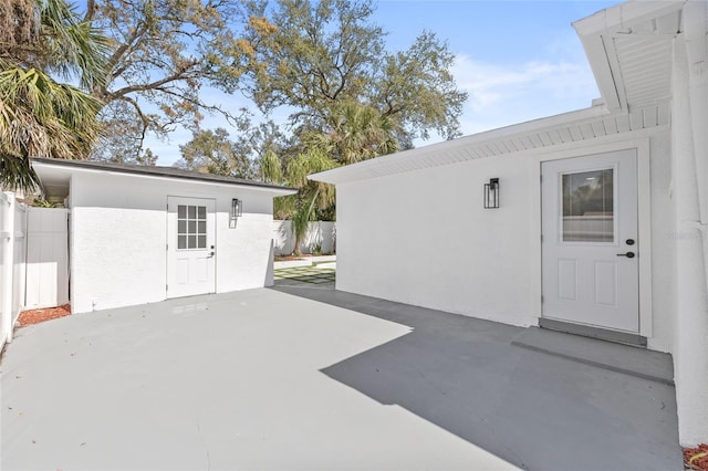 view of patio featuring fence