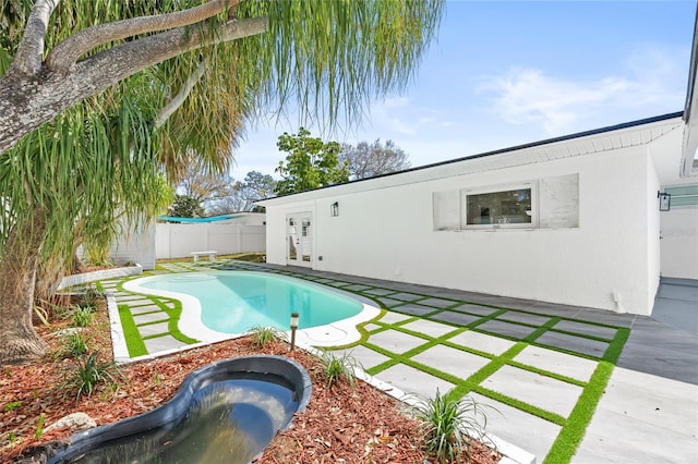 view of swimming pool featuring a fenced backyard, a fenced in pool, and a patio