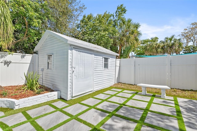 view of shed with a fenced backyard