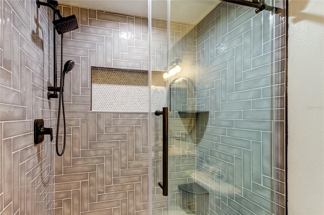 bathroom featuring a shower stall