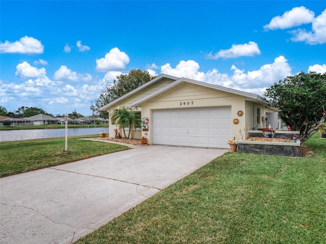 single story home with a garage, a water view, concrete driveway, stucco siding, and a front lawn