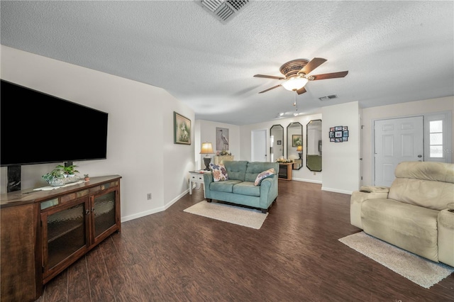 living room with arched walkways, ceiling fan, wood finished floors, and visible vents