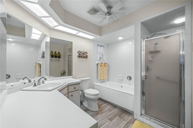 full bath with a tub to relax in, visible vents, toilet, an enclosed shower, and wood finished floors