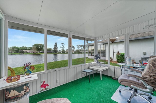 sunroom / solarium with a water view and plenty of natural light