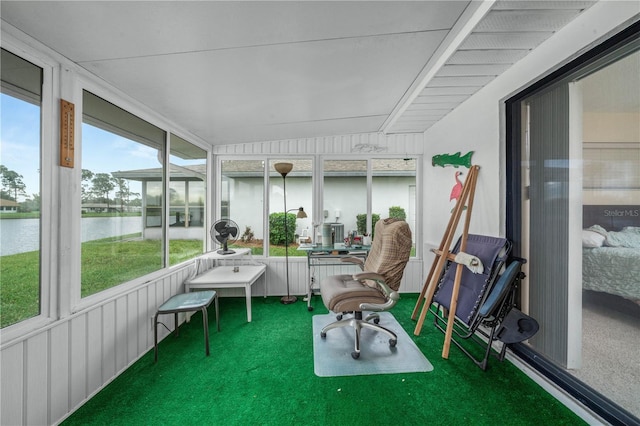 sunroom with a water view