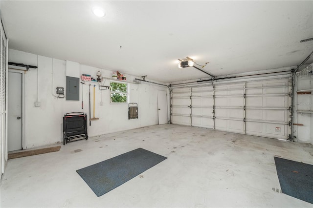 garage featuring electric panel and a garage door opener