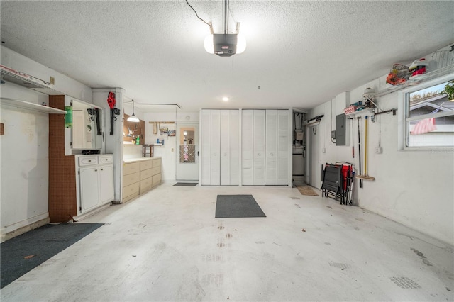 garage featuring a garage door opener and electric panel