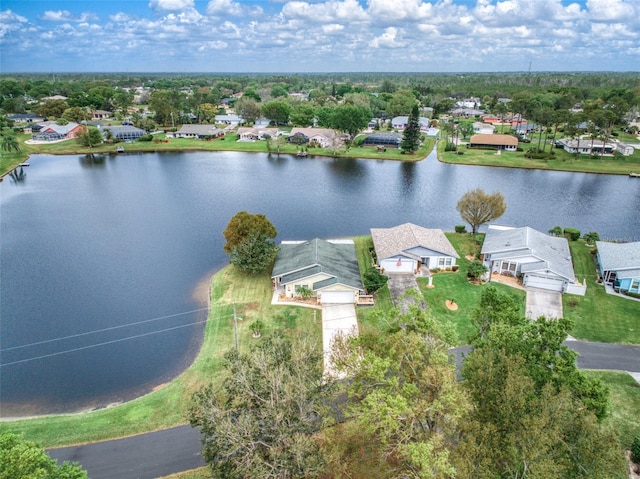 birds eye view of property featuring a residential view and a water view