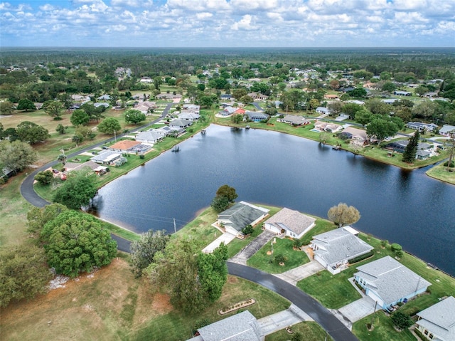 birds eye view of property featuring a residential view and a water view