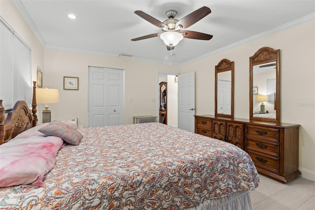 bedroom with a ceiling fan, a closet, crown molding, and baseboards