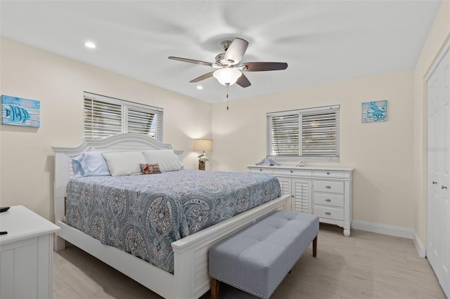 bedroom with baseboards, a ceiling fan, light wood-type flooring, a closet, and recessed lighting