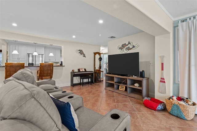 living room featuring baseboards, tile patterned flooring, visible vents, and recessed lighting