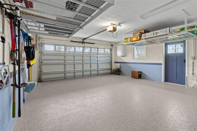 garage featuring a garage door opener