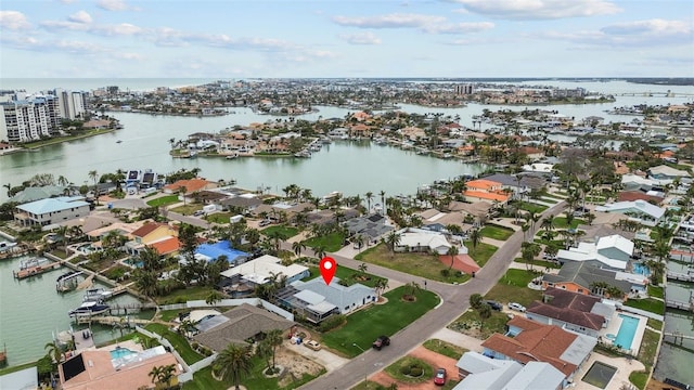 drone / aerial view featuring a residential view and a water view