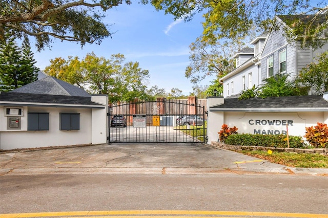 view of gate with fence