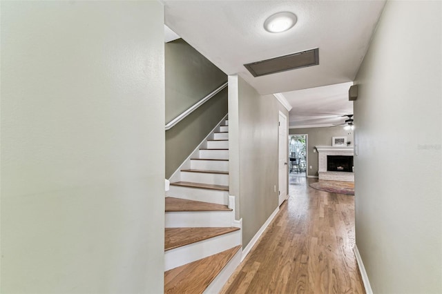 interior space with stairway, baseboards, and wood finished floors