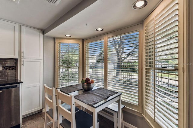 tiled dining space featuring visible vents and recessed lighting