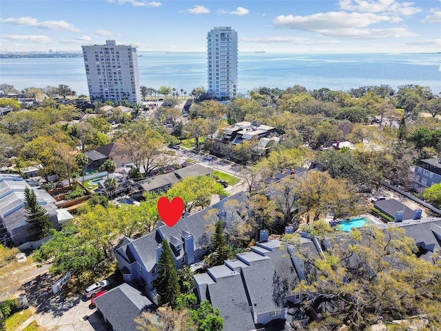 drone / aerial view of a large body of water and a pool