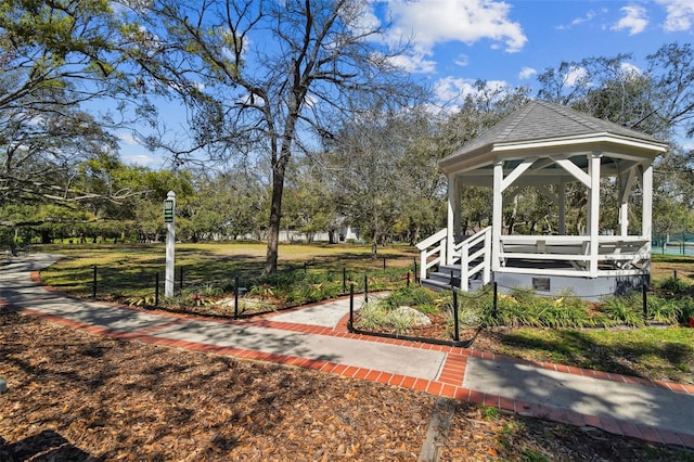 view of property's community featuring a gazebo and view of scattered trees