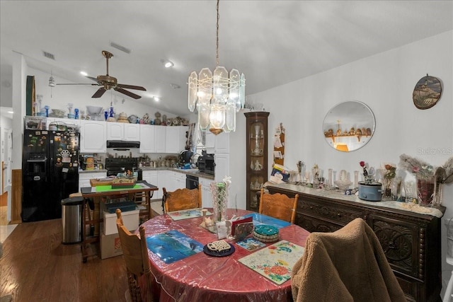 dining area with lofted ceiling, visible vents, ceiling fan, and wood finished floors