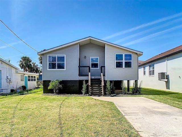 view of front facade featuring a front yard and stairway