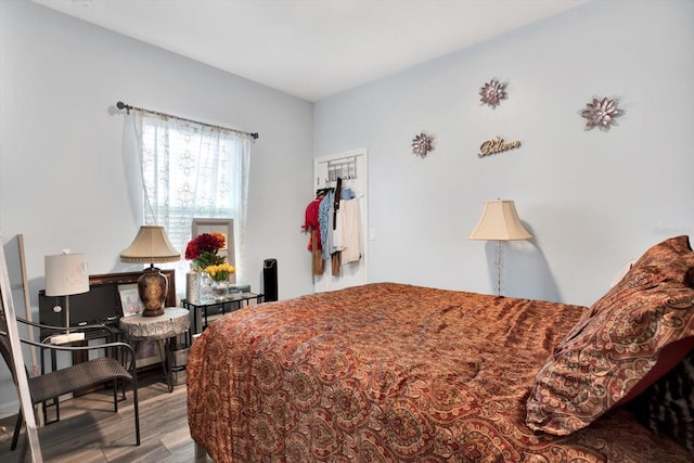 bedroom with wood finished floors