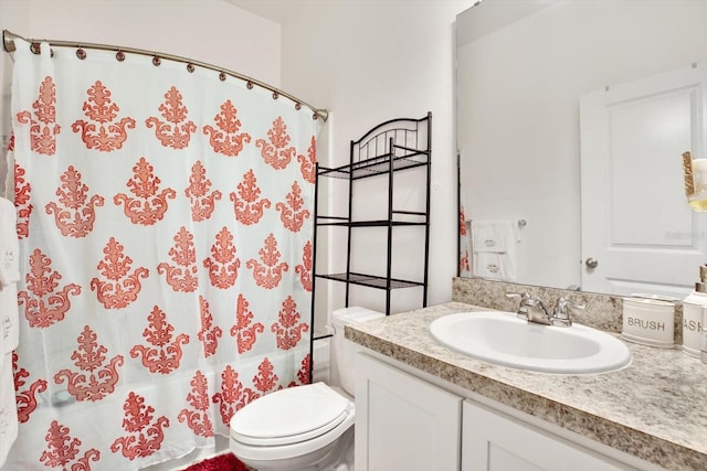 bathroom featuring toilet, shower / bath combination with curtain, and vanity