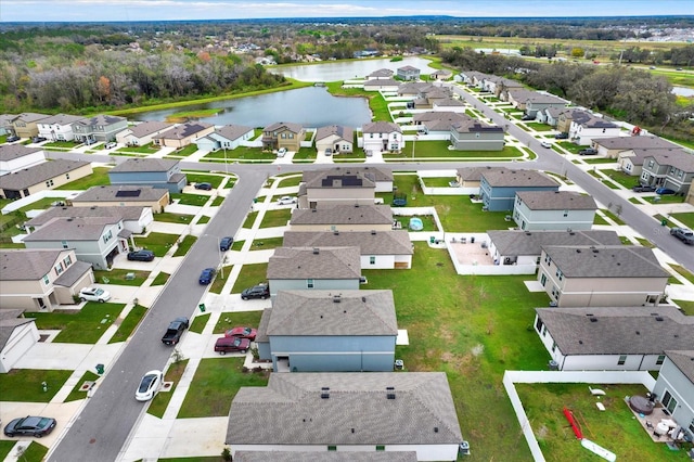 birds eye view of property with a residential view and a water view