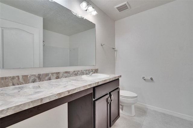 full bathroom with baseboards, visible vents, toilet, tile patterned flooring, and vanity