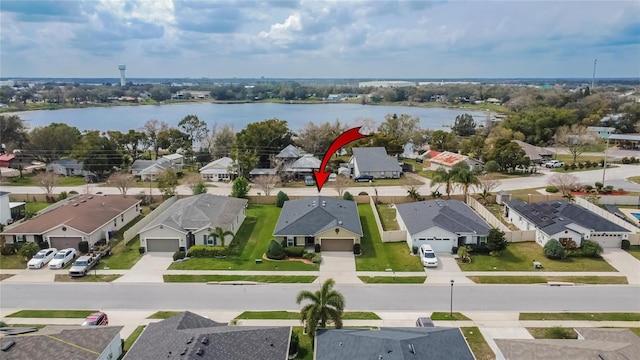 aerial view featuring a water view and a residential view