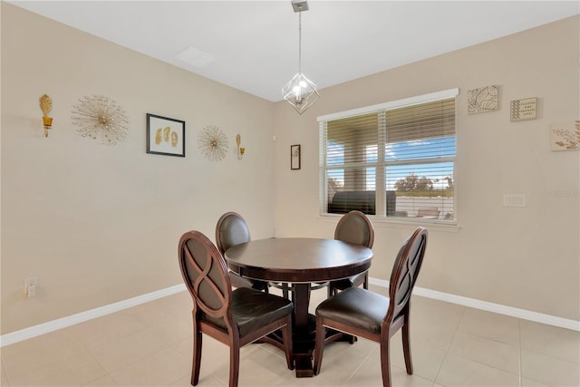 dining area with baseboards and light tile patterned flooring