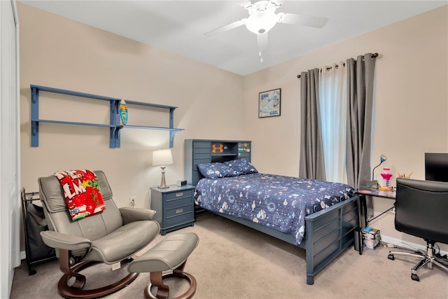 bedroom with light carpet and a ceiling fan