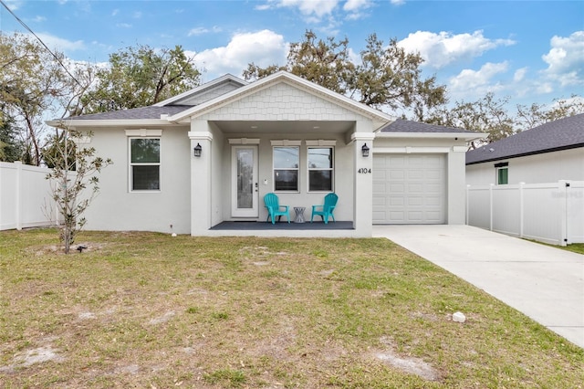 single story home featuring a porch, concrete driveway, fence, a garage, and a front lawn