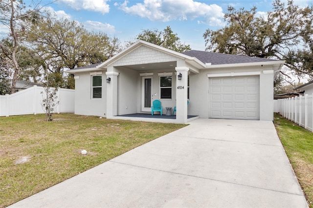 ranch-style home featuring a garage, fence, driveway, and stucco siding