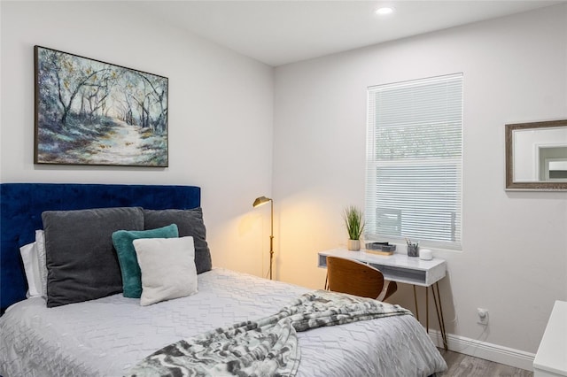 bedroom with recessed lighting, baseboards, and wood finished floors