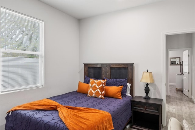 bedroom with wood finished floors